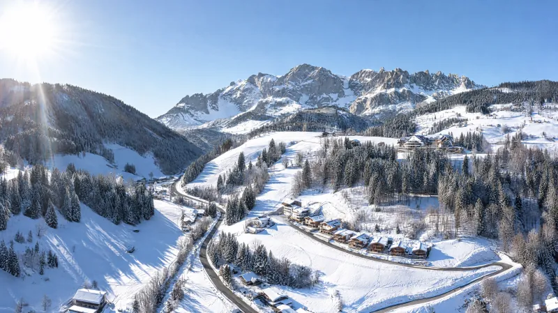 Snowy mountain landscape with an alpine village before the Hochkönig massif