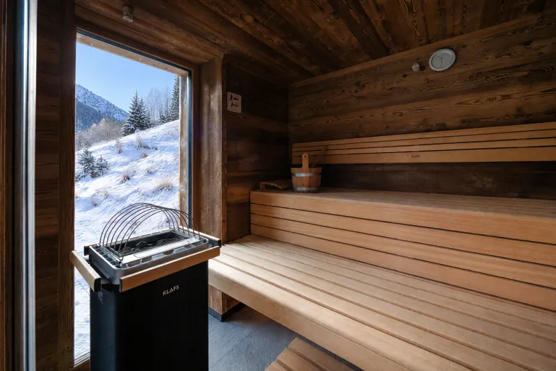 Sauna benches with views over snowy hills